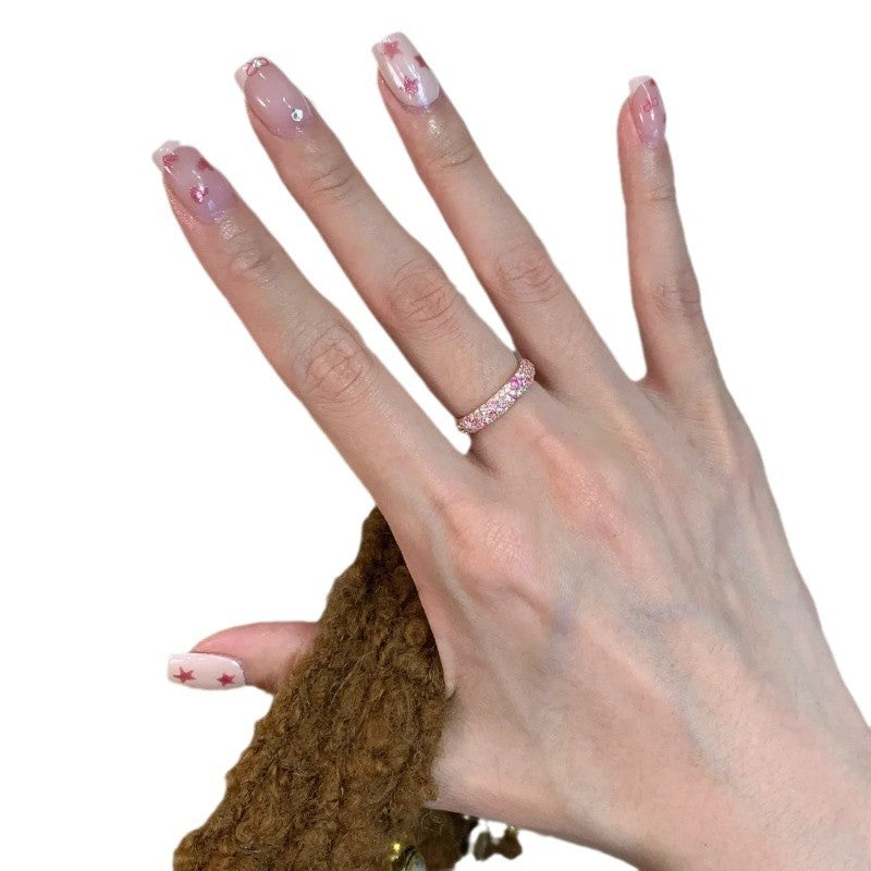 Bague ouverte rose avec détails brillants