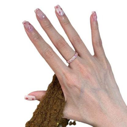 Bague ouverte rose avec détails brillants
