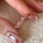 Bague ouverte rose avec détails brillants